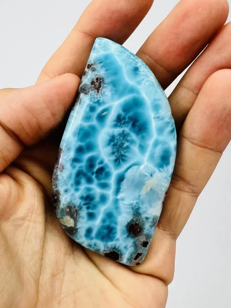 A Dominican Larimar specimen, macro — sky-blue with white web-like figure