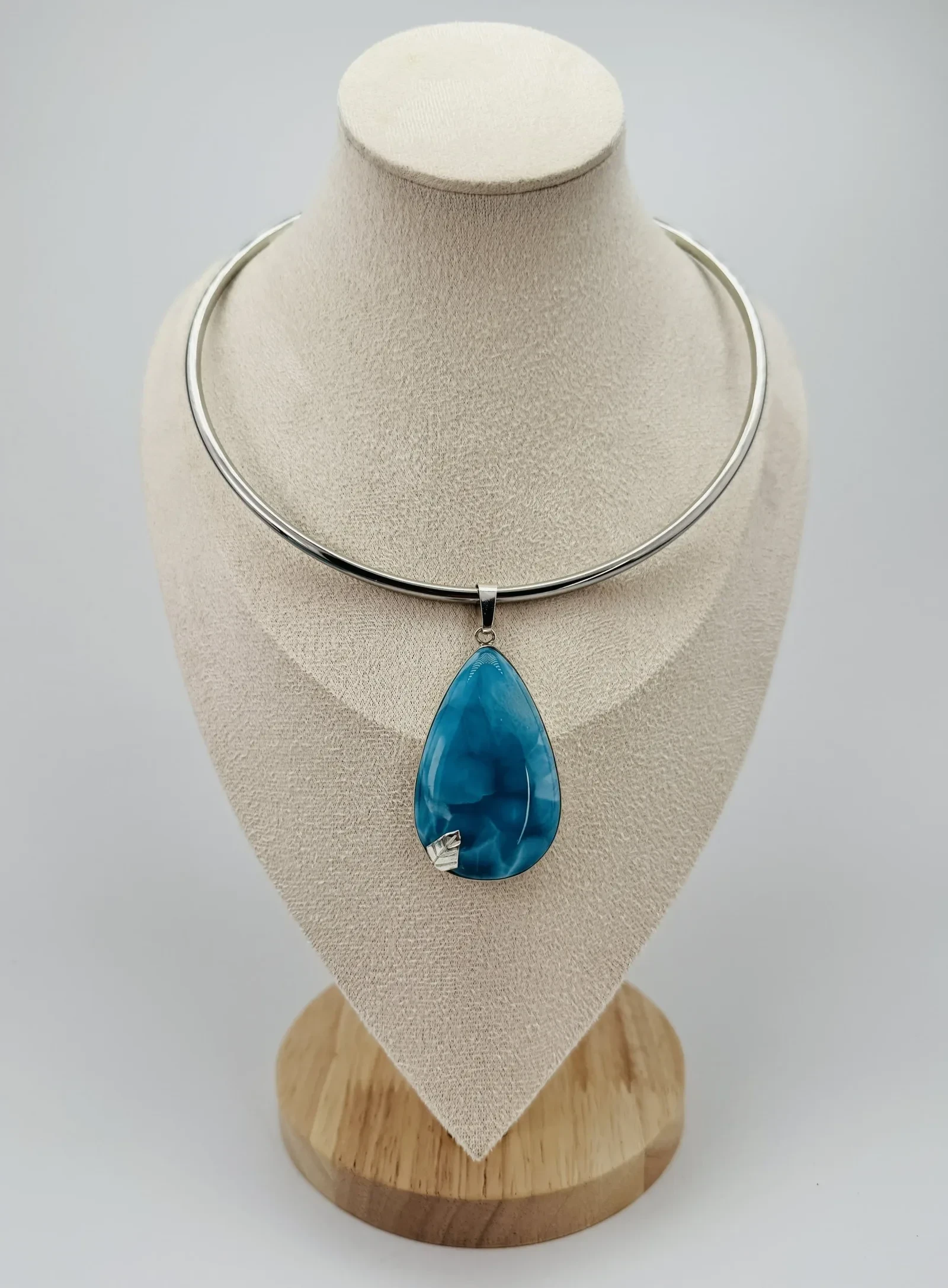 A finished Larimar pendant necklace.
