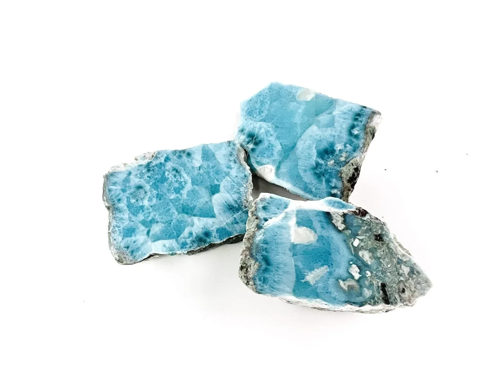 Two matching cut faces of a Larimar specimen.