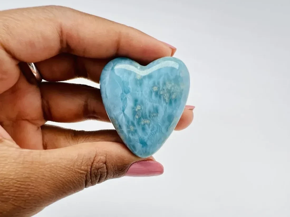 A polished blue heart-shaped Larimar specimen.