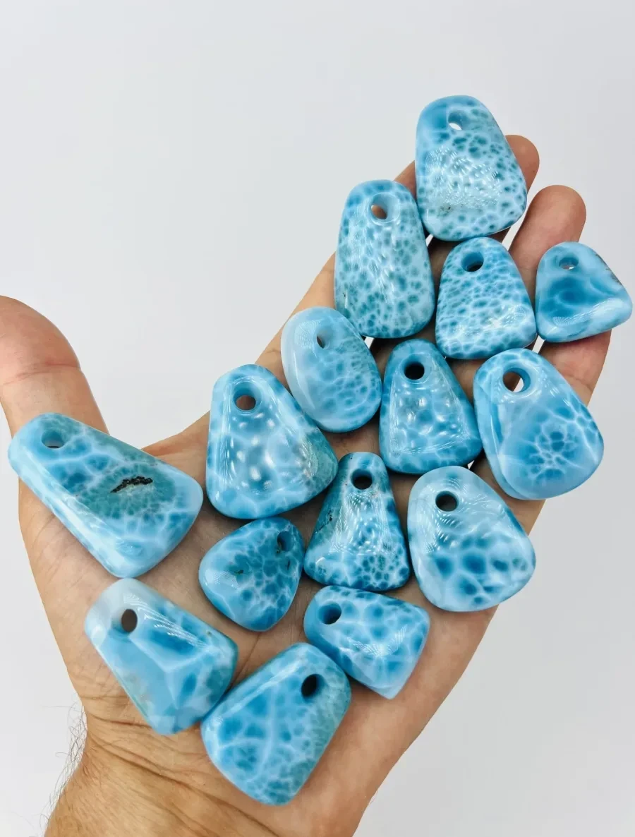 Many small finished Larimar pendants and forms.
