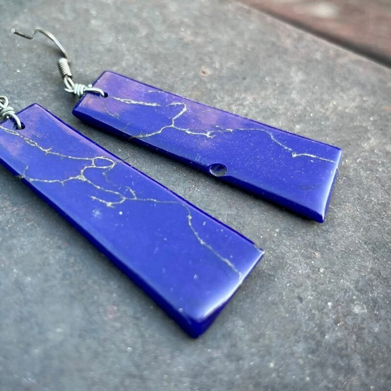 Deep blue dyed howlite pendants with pale veining, shown for comparison