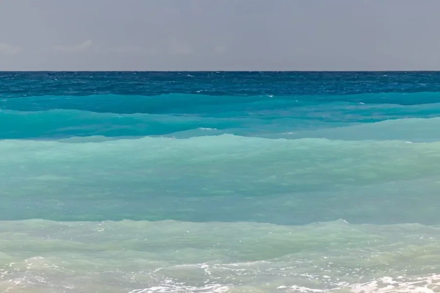 Sunlight moving across the blue Caribbean sea.